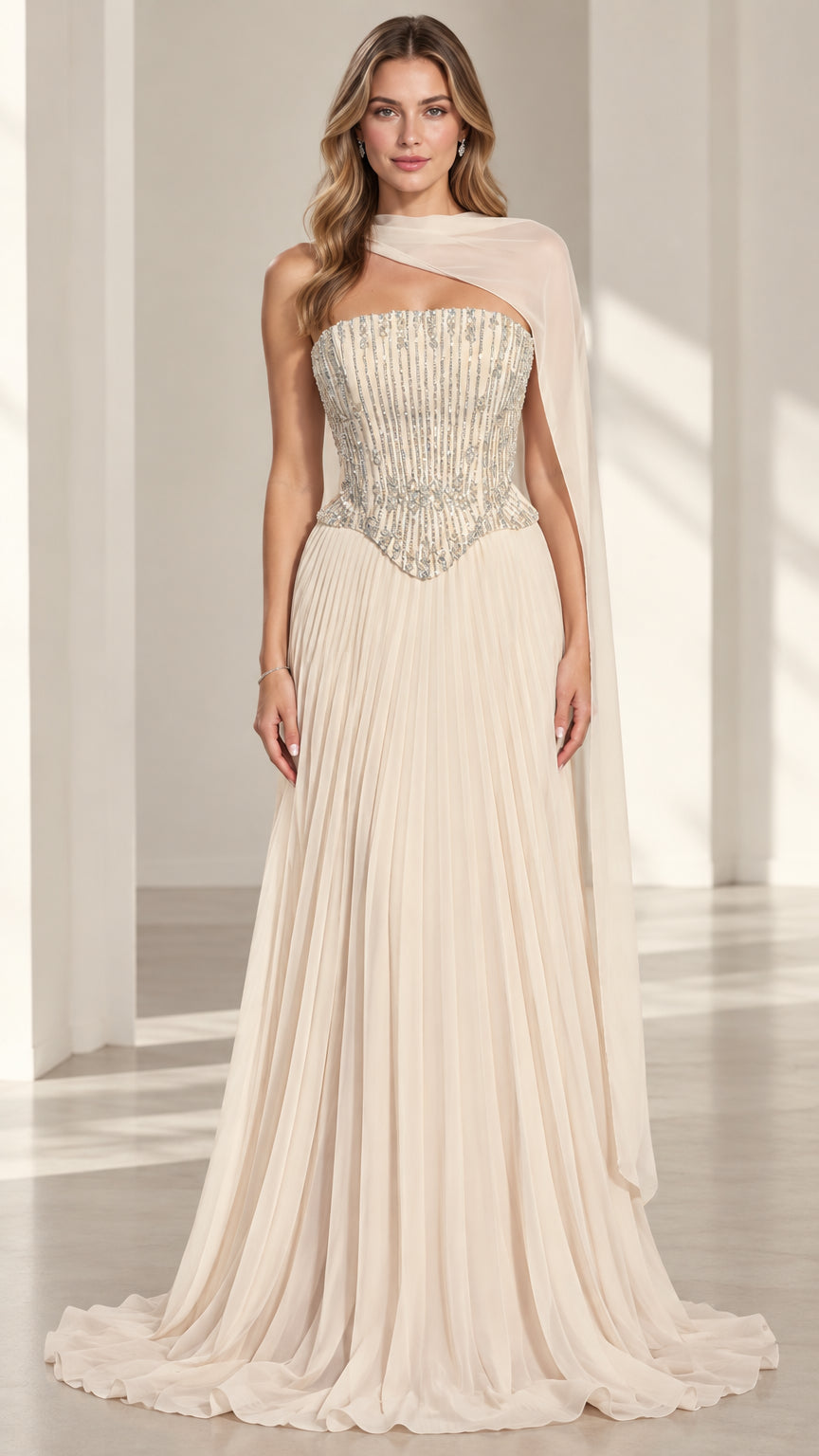 Champagne strapless beaded corset evening gown with pleated skirt and draped scarf front view