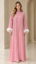 Front full view of dusty pink rhinestone embellished maxi kaftan dress with white feather cuffs