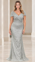 Front view of model wearing a shimmering silver beaded mermaid evening gown with cap sleeves