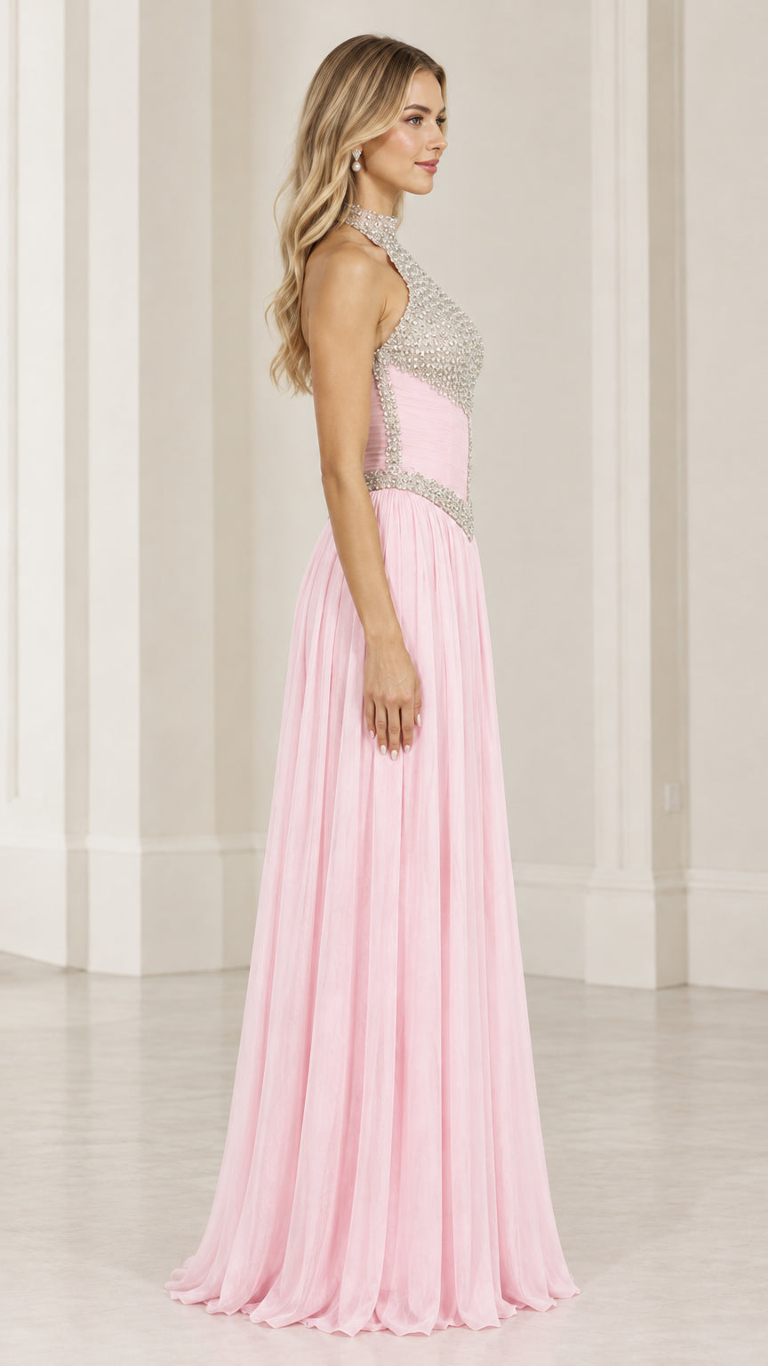 Side profile of pink halter neck beaded bodice evening dress with pleated skirt