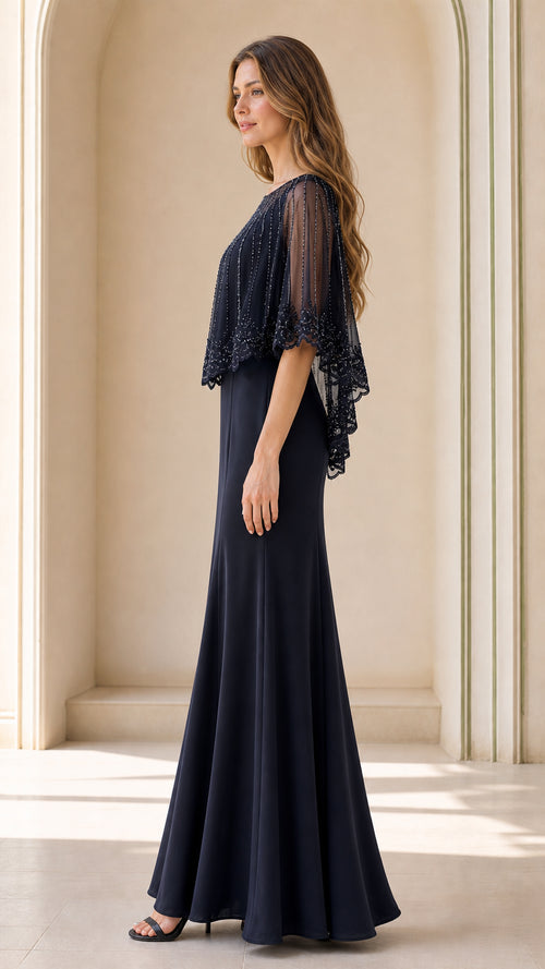 Side profile view of navy blue formal capelet gown