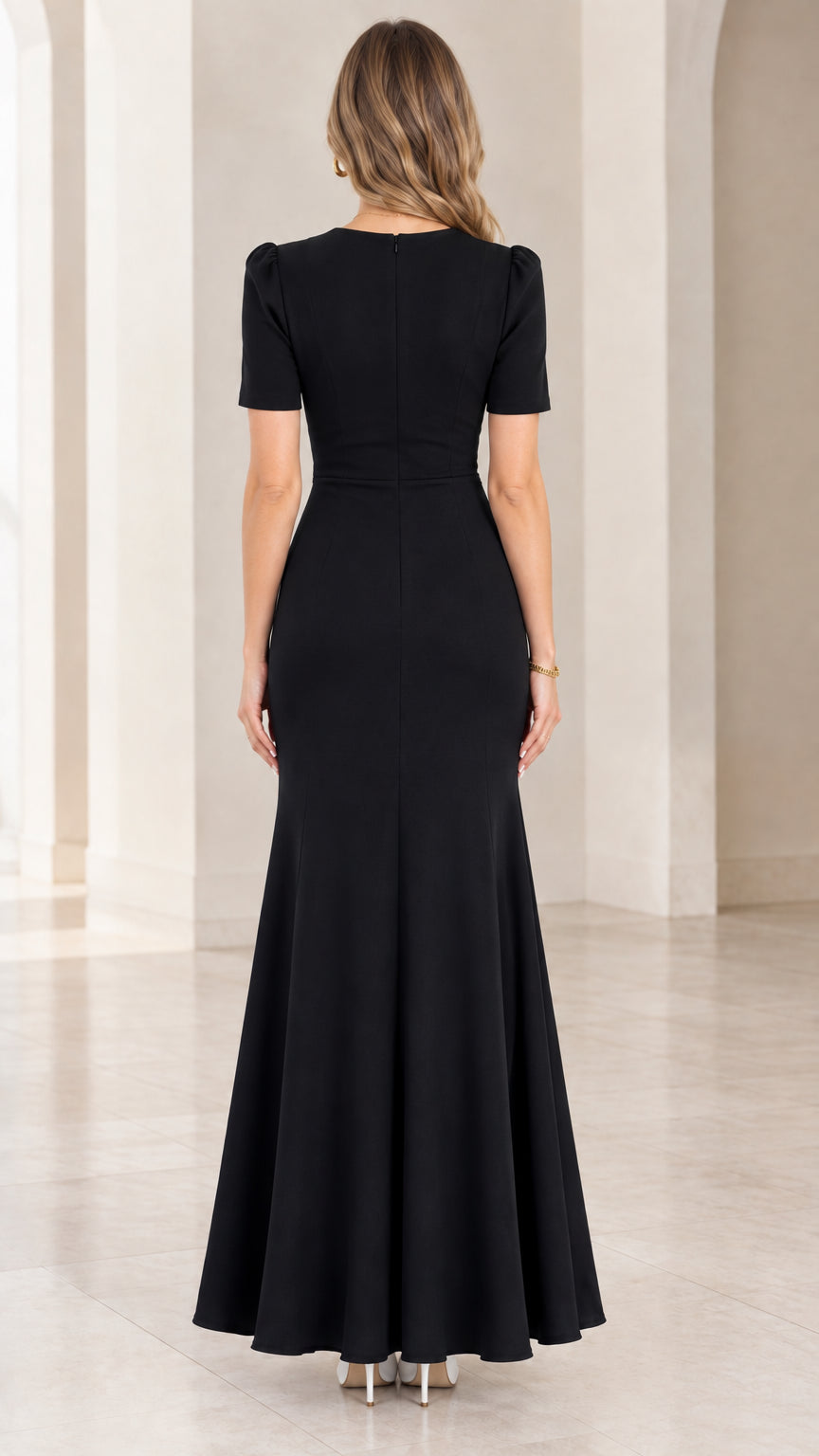 Back full-length view of fitted black evening gown with concealed zipper