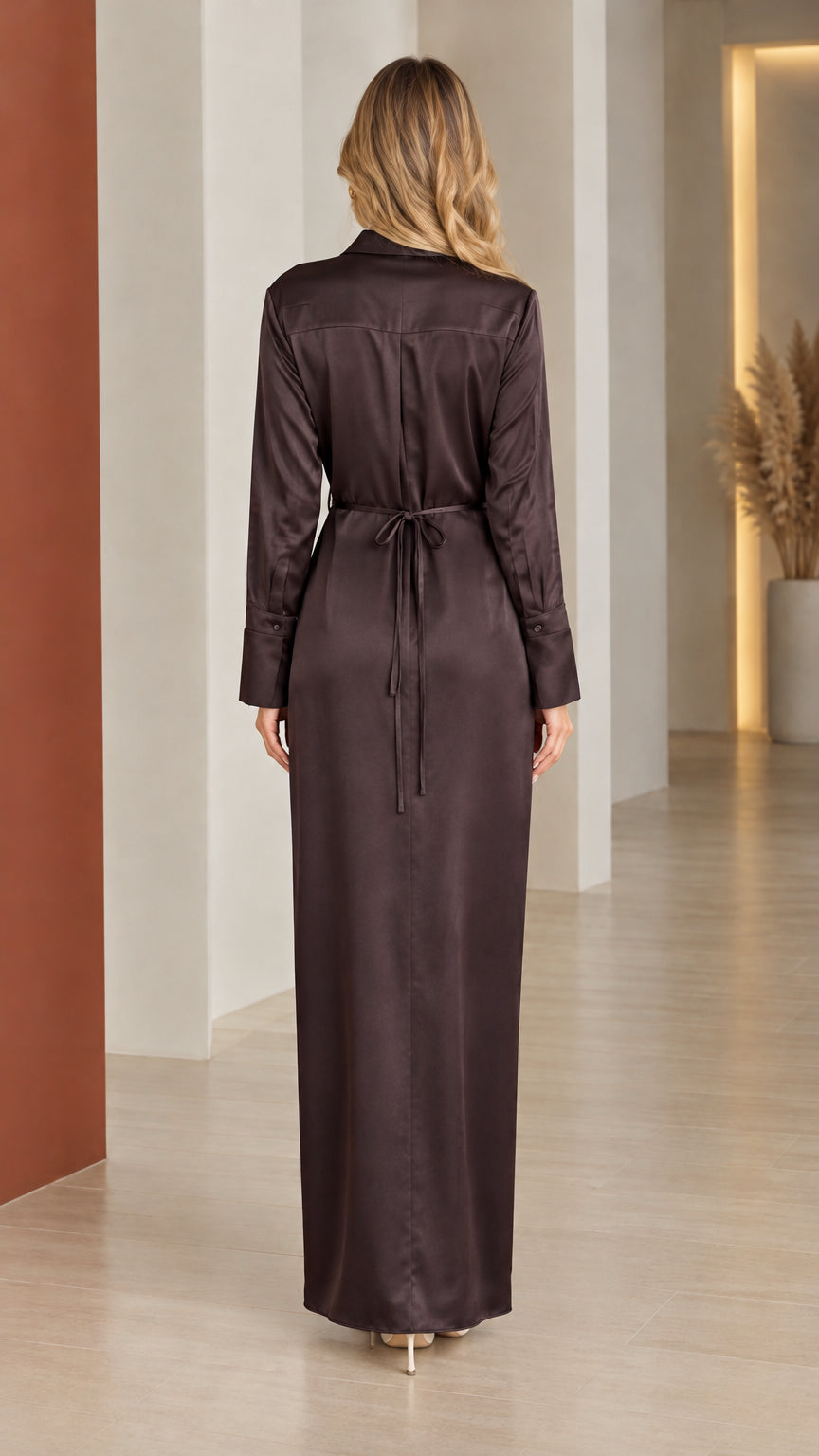 Back view of model showing back tie detail on espresso satin maxi dress