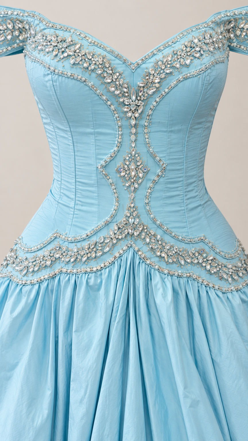 Close-up detail of intricate rhinestone and crystal beading on light blue corset bodice