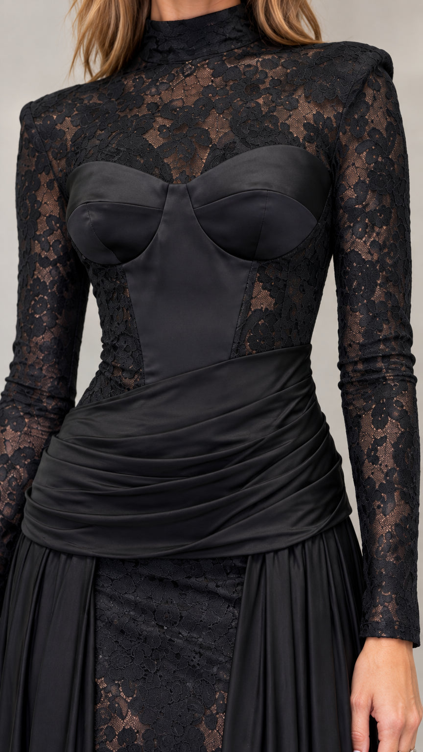 Close up of black lace mock neck and structured bustier bodice with draping