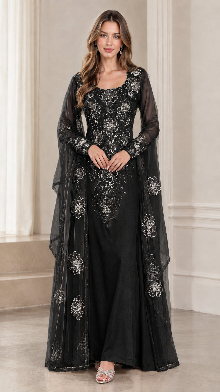 Full-length black floral embroidered lace evening gown with cape sleeves