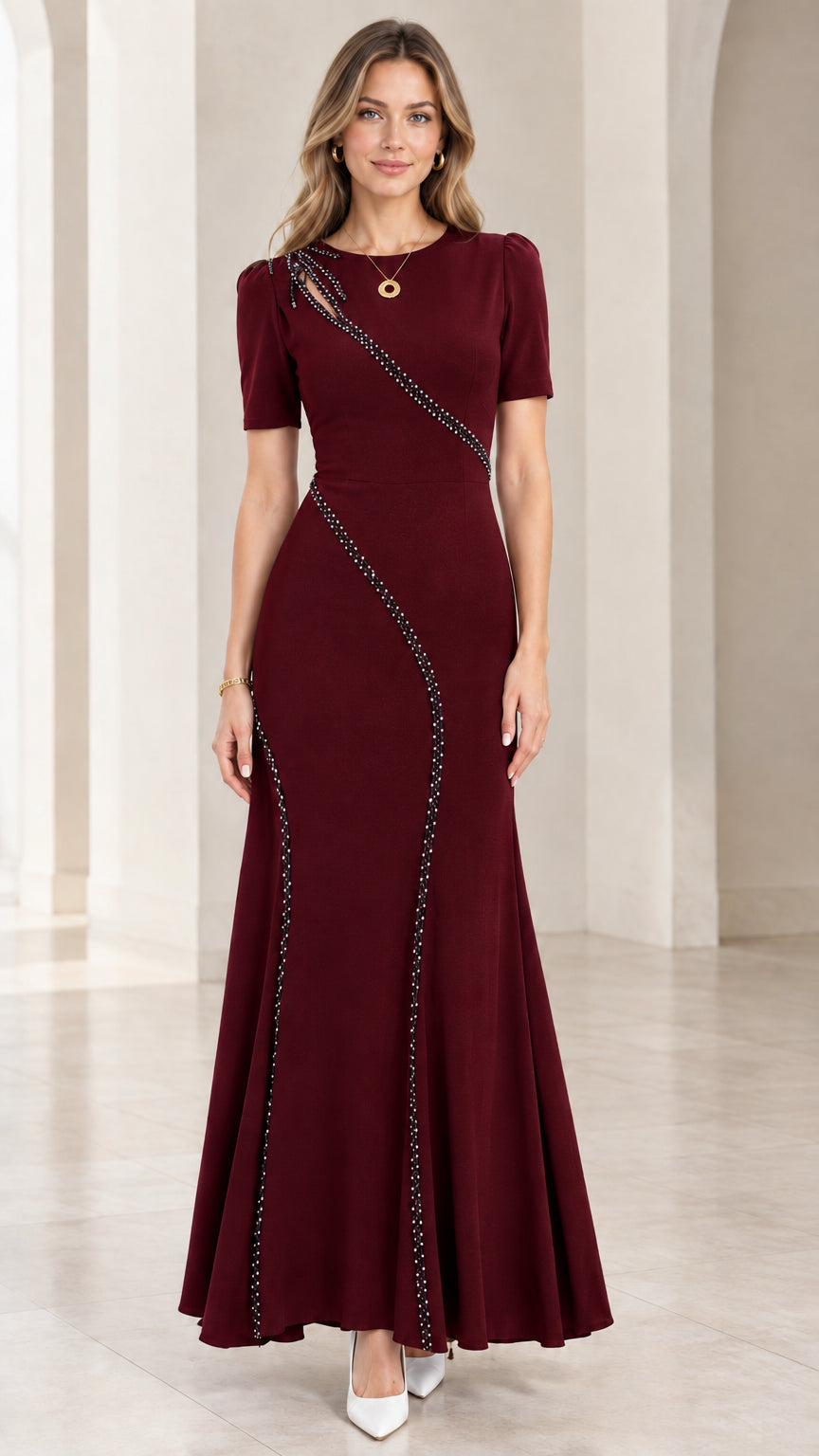 Front full-length view of burgundy red beaded cutout mermaid maxi gown