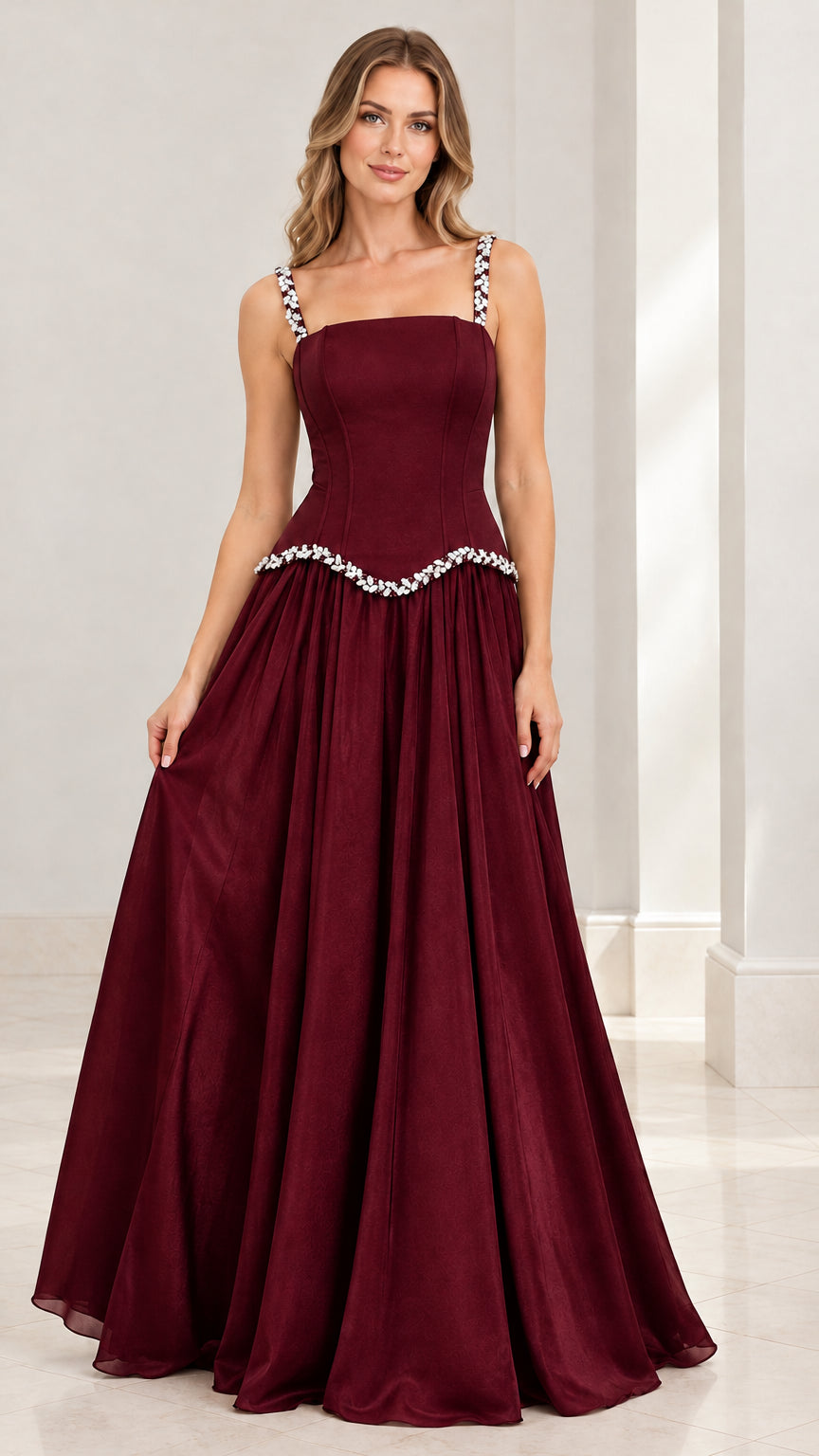 Model wearing the deep burgundy red rhinestone strap evening gown