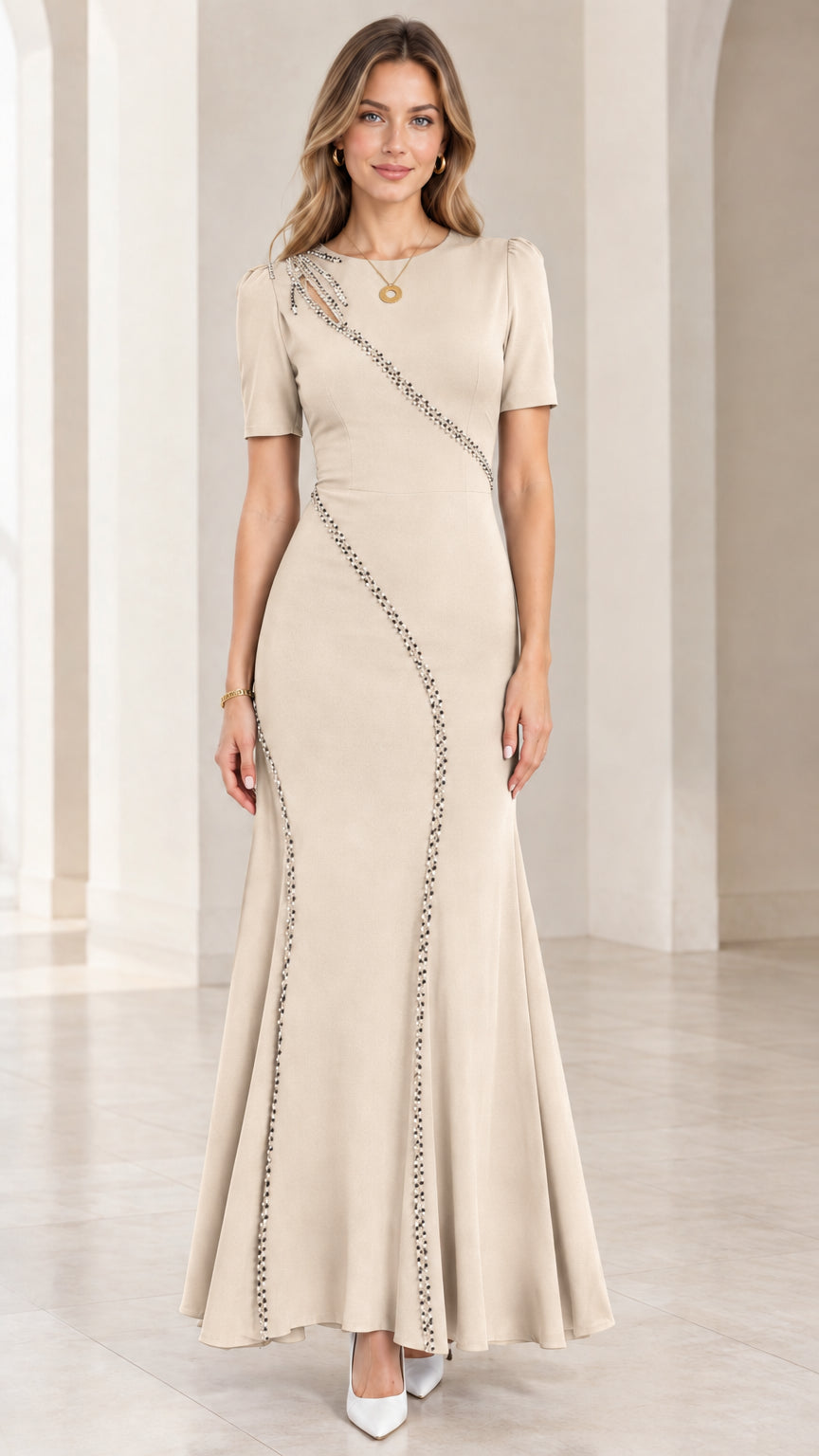 Front full-length view of beige champagne beaded cutout mermaid maxi gown